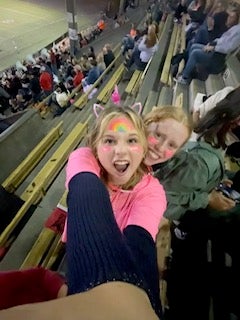 Two girls at an athletic event