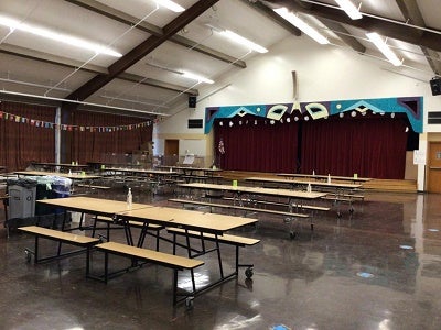 Lowell cafeteria with tables set up for lunch