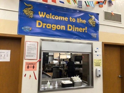 Sign in cafeteria that says "welcome to the dragon diner!"