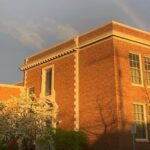 Loyal Heights school building with a rainbow above