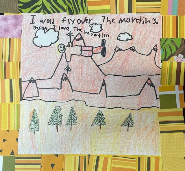 cut paper and pastels used to create landscape of houses and the moon.
