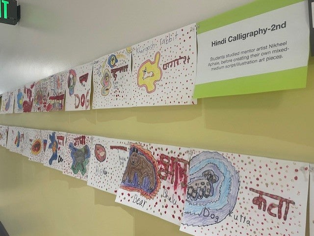 wall of projects of Students studied mentor artist Nikheel Aphale, before creating their own mixed medium script/illustration art pieces based on Hindi Calligraphy
