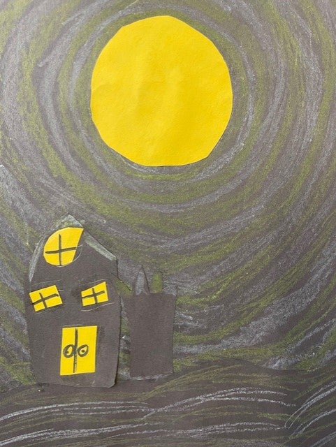 cut paper and pastels used to create landscape of houses and the moon.