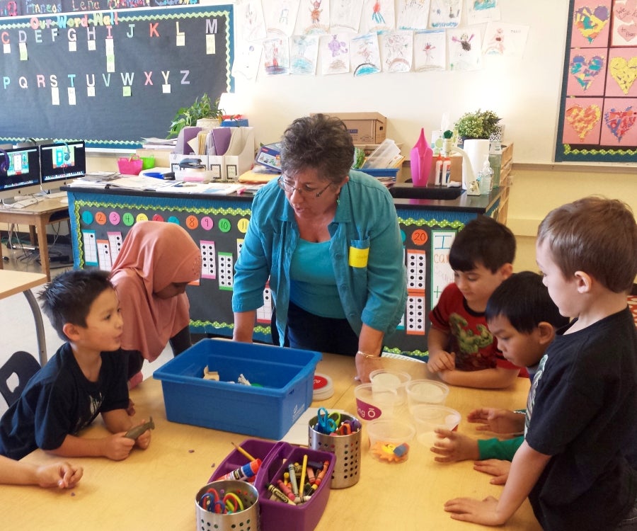 Volunteer working in kindergarten class