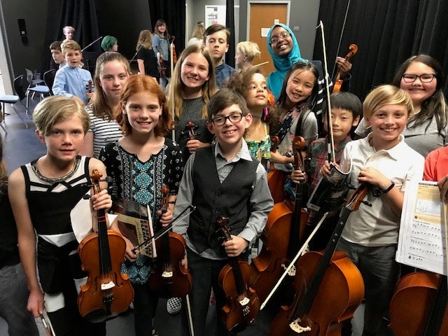 Instrumental Music students back stage before concert