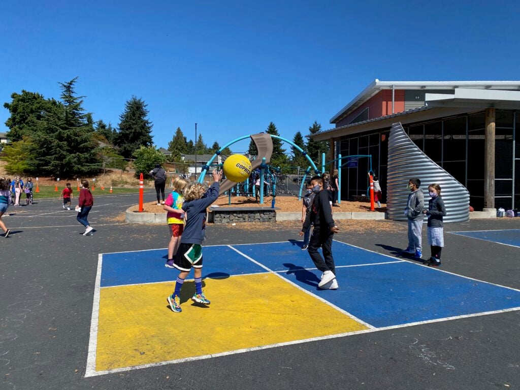 Students playing foursquare during recess