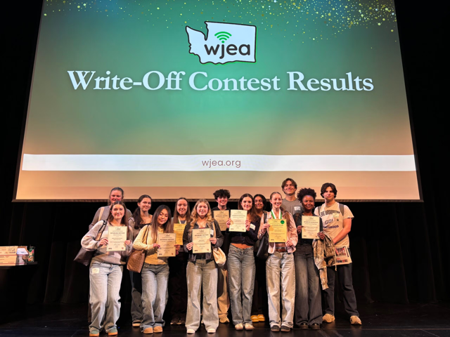 Text: Write Off Contest Results and students holding awards.