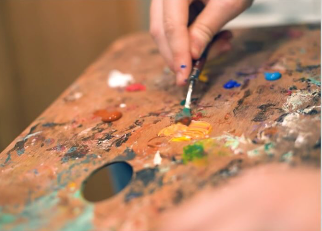 Artist Pallet and hand with brush. A Moment In Time Film
