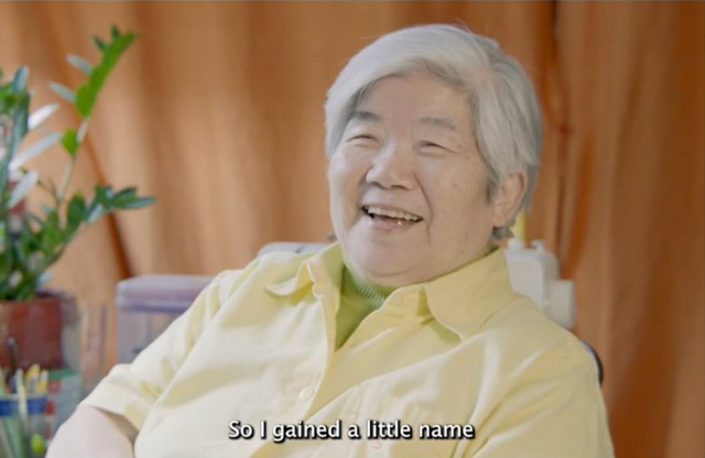 Person sitting smiling. Chou's Buffet Film.