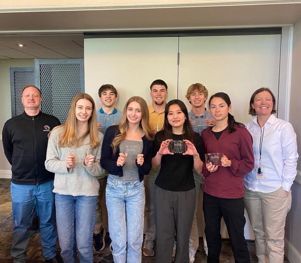 Athletic Director Eric Ensign and Principal Abby Hunt. Front row (l-r): Brooke Adkins and Caitlyn Adkins (gymnastics), Alyson Chew (swim), and Holland Young (track). Back row: Miles Price (wrestling), Lake Christensen (football), and Alex Davis (track).