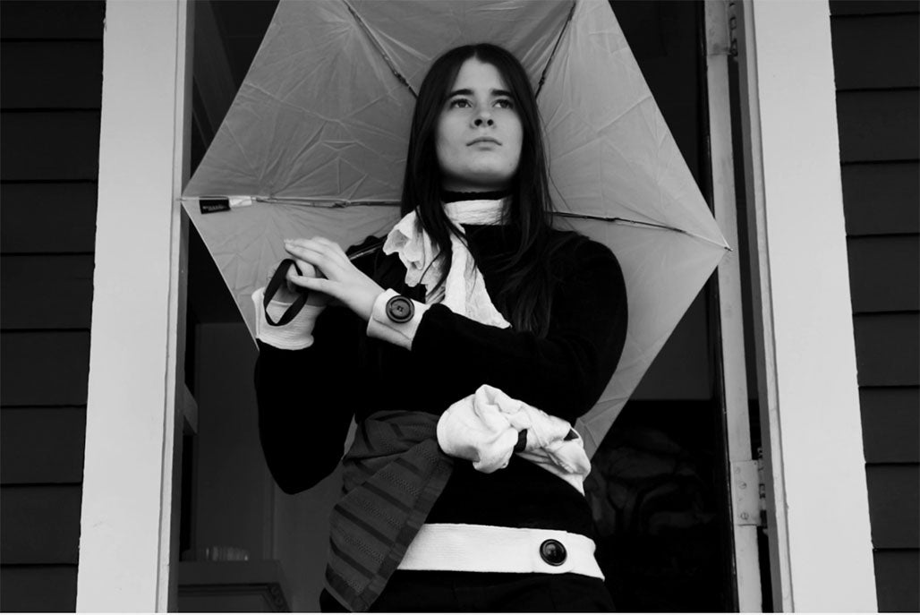 Person with umbrella. Agoraphobe- Director: Oleksandra Prokopenko ‘27; Writers: Maddie Irish’27, Griffyn Braly ‘27; Photographer: Sophia Poole ‘27