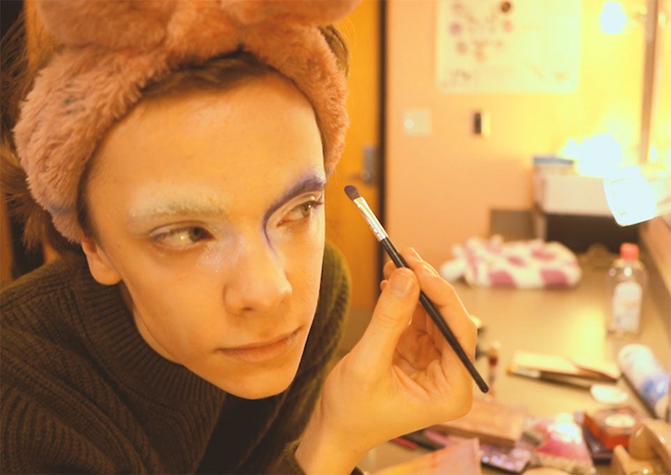 Person putting on make up. Nonfiction Long Form: Glitter and the Gospel Director: Lake Neill ‘26, Editor: Gianna Goldyn ‘26