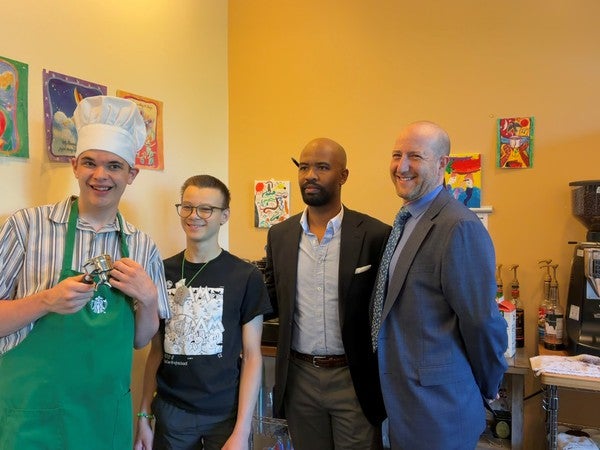 Students with Superintendent at coffee stand