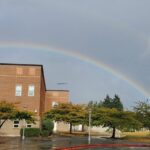 Ballard HS Building with Rainbow arch behind it