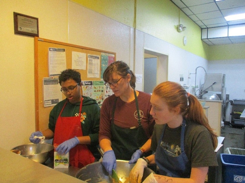 students washing dishes
